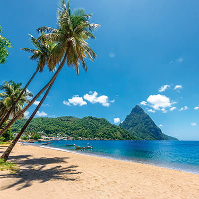 A view towards the Pitons in St Lucia from a beach in Soufriere